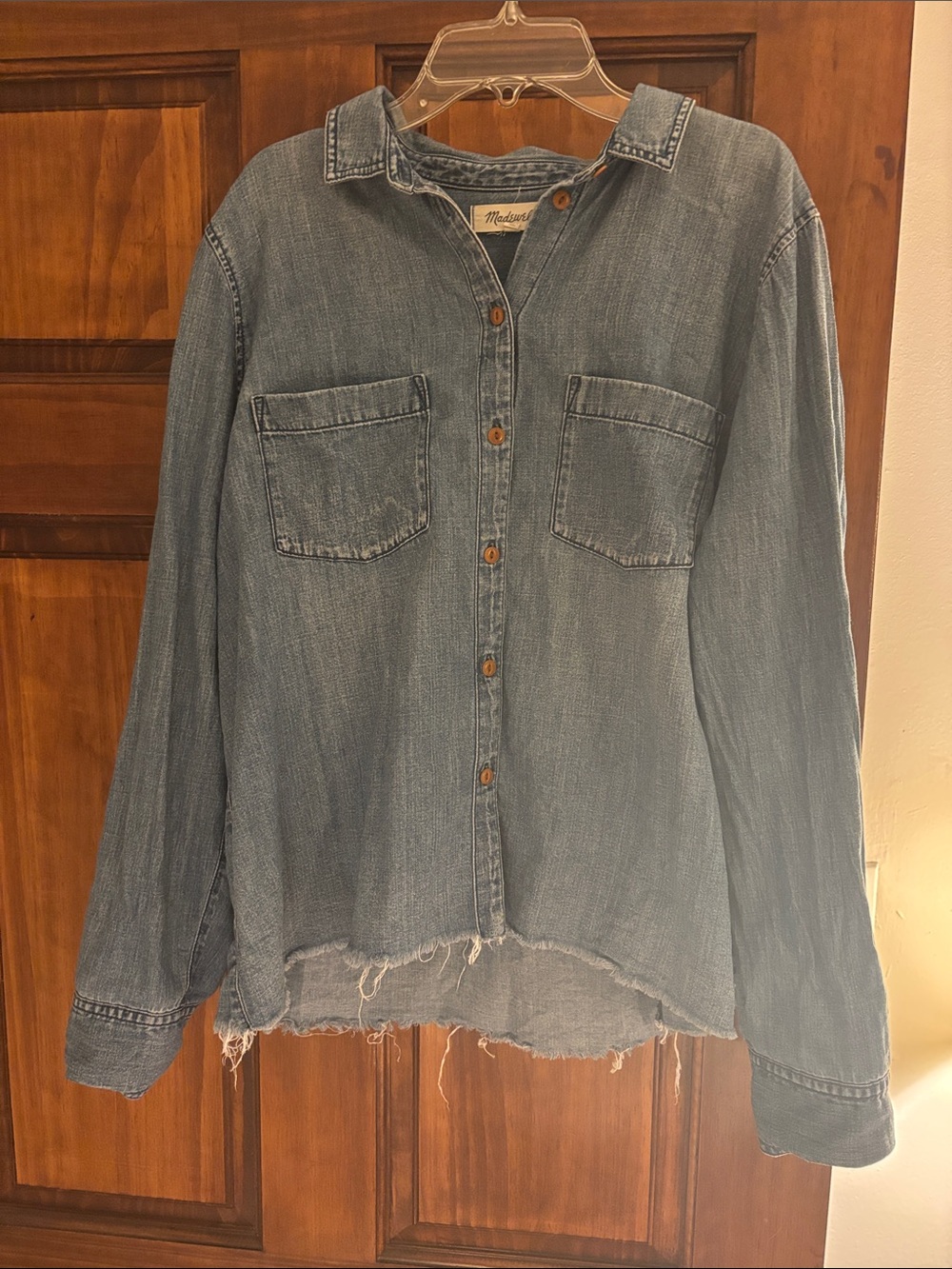 Madewell women’s long sleeve denim shirt with frayed hem